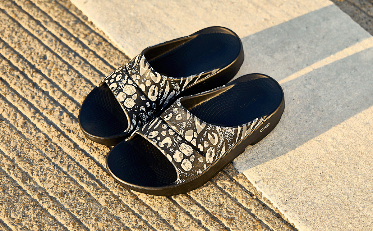Women's OOahh Limited Slide Sandal - Combo Camo product on pavement outside | lifestyle