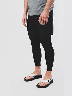 Men's OOriginal Sport Sandal - Cloud White - OOFOS model standing in shoes