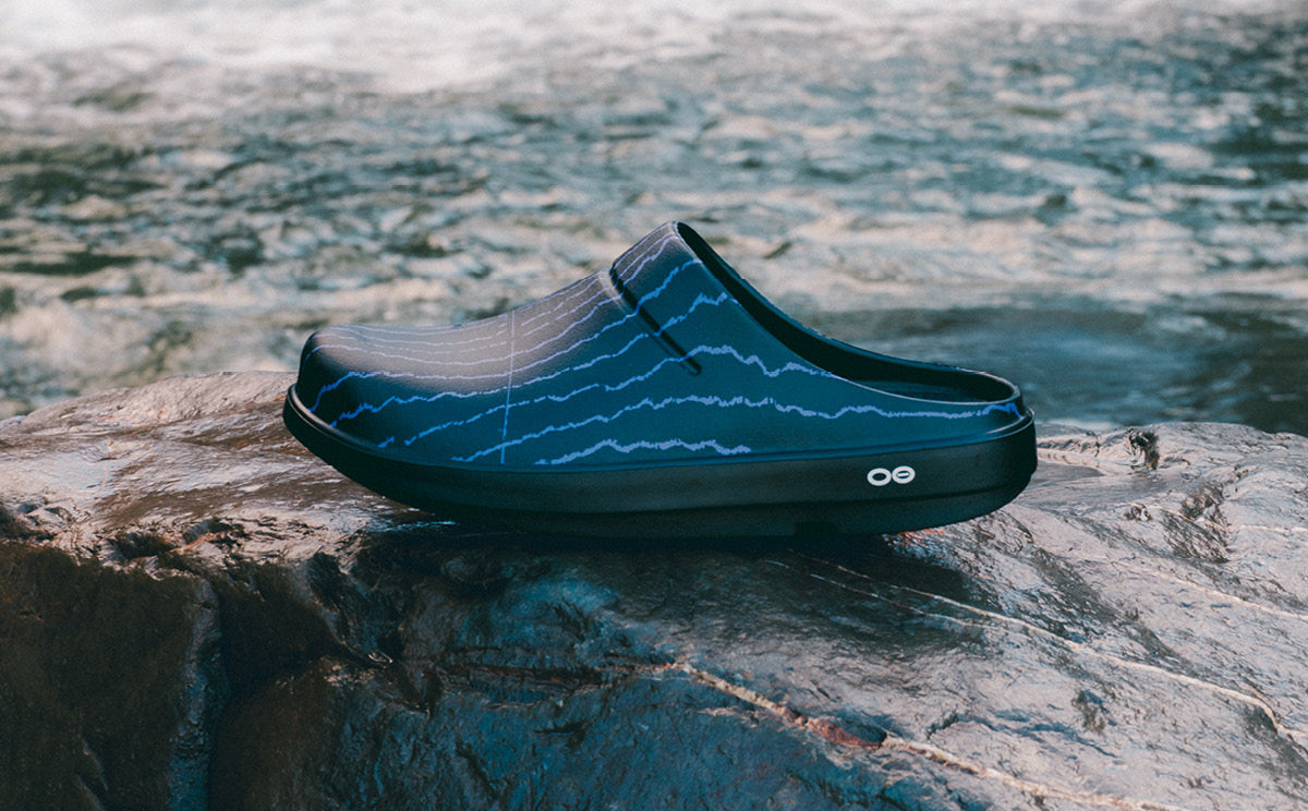 Usal x OOFOS Cochno Clog on rock outside | lifestyle