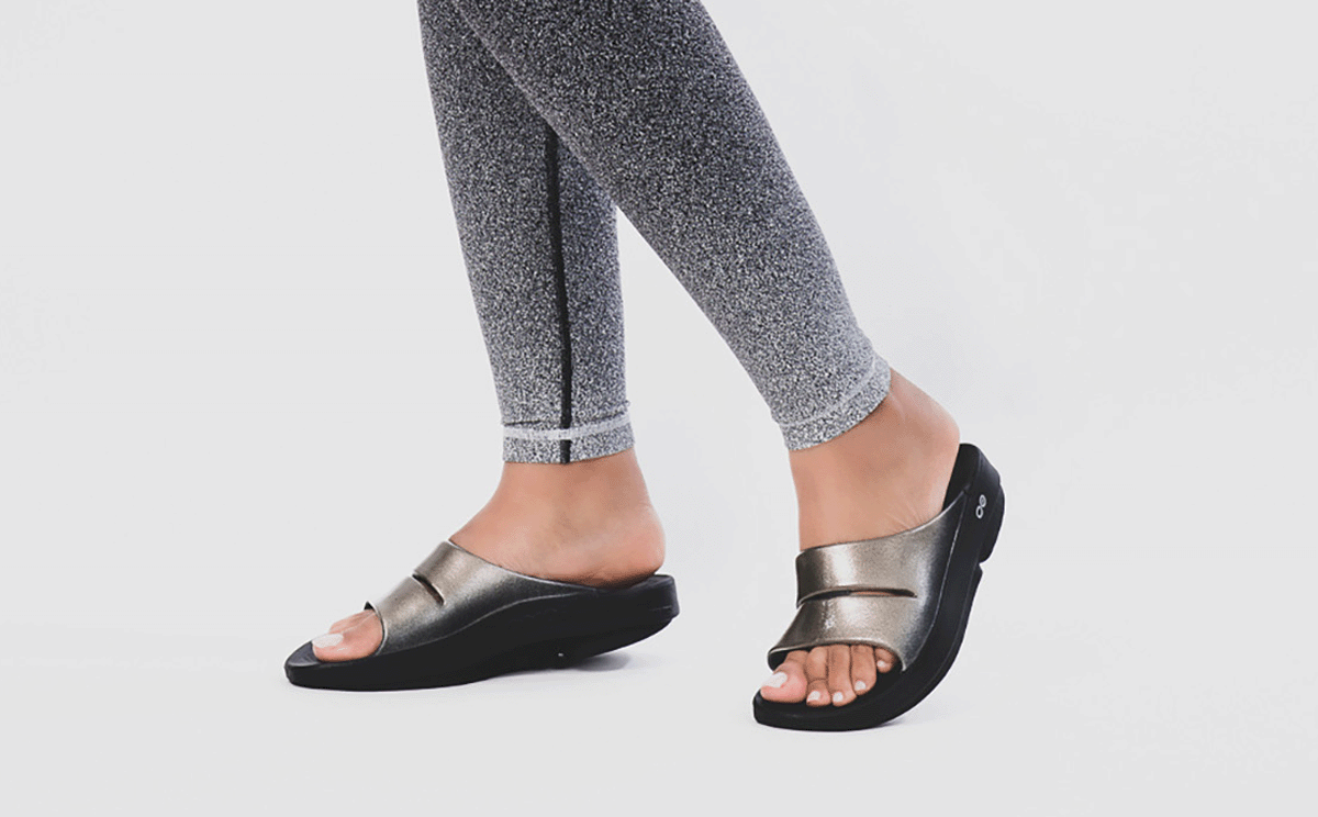 Women's OOahh Luxe Slide Sandal - Latte model posing in studio | lifestyle