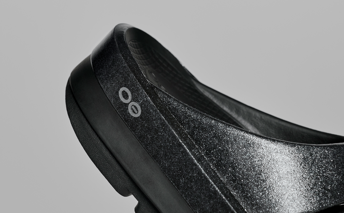 Women's OOmega OOahh Stacked Sandal - Black Sparkle close up of shoe in studio | lifestyle