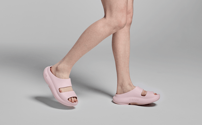 Women's OOyea Slide Sandal - Primrose model walking in studio | lifestyle