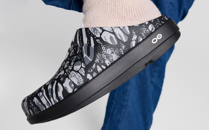 Women's OOcloog Limited Edition Clog - Combo Camo close up side view of shoe on model | lifestyle