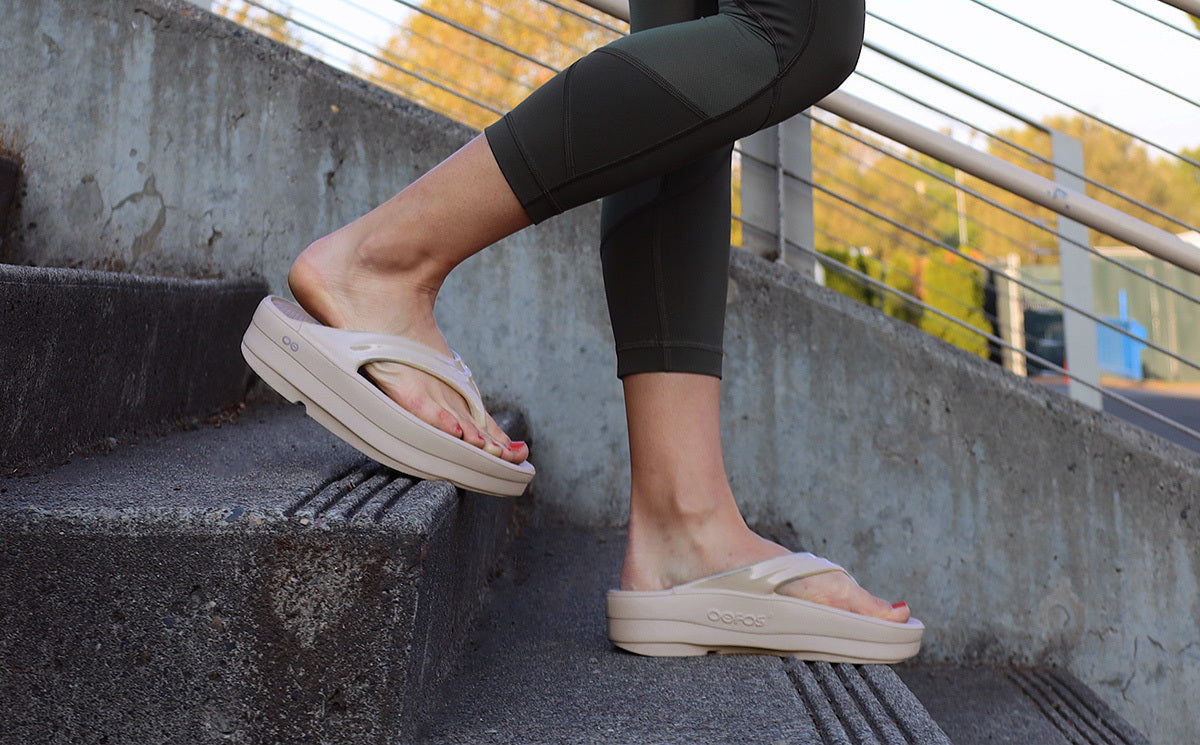 Women's Nomad OOmega OOlala model walking down stairs in shoe | lifestyle