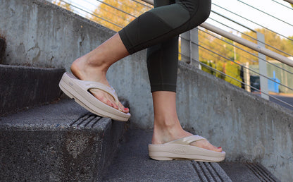 Women's Nomad OOmega OOlala model walking down stairs in shoe | lifestyle