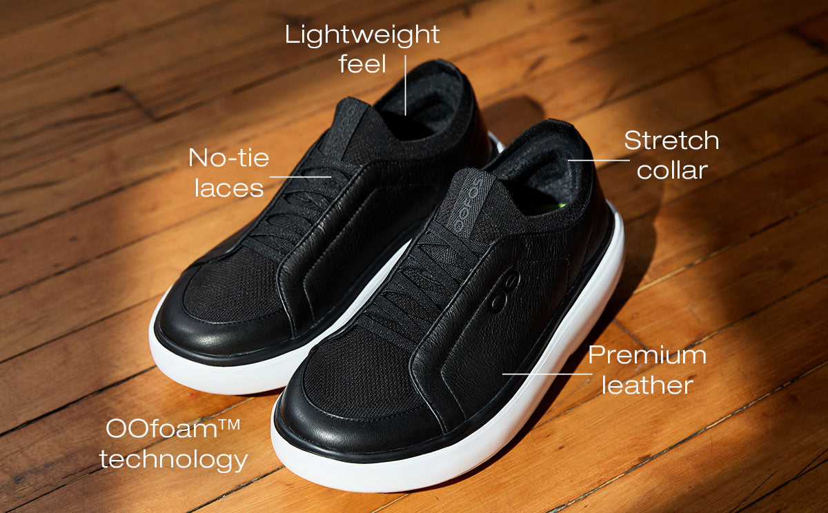 Black sneakers on a wooden floor with features labeled
