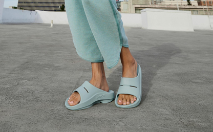 Women's OOahh Slide Sandal - Mist model standing outside | lifestyle