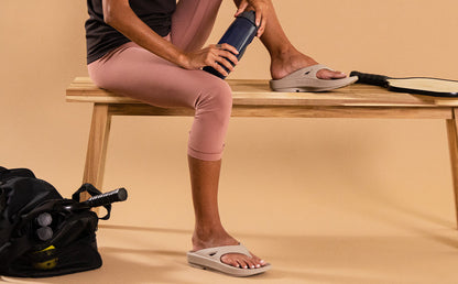 Women's OOriginal Sandal - Nomad studio image of model sitting in shoes