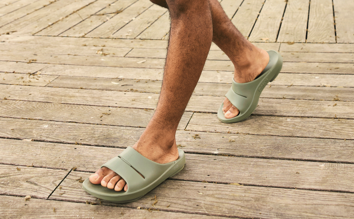 Men's OOahh Slide Sandal - Foliage model walking outside | lifestyle