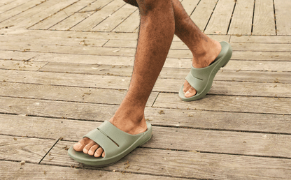 Men's OOahh Slide Sandal - Foliage model walking outside | lifestyle