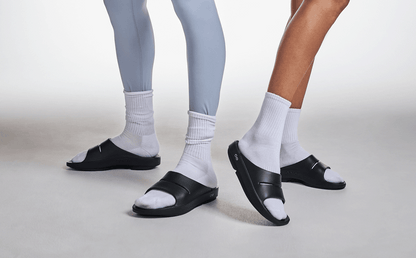 OOahh Slide Sandal - Black male and female model posing in studio | lifestyle