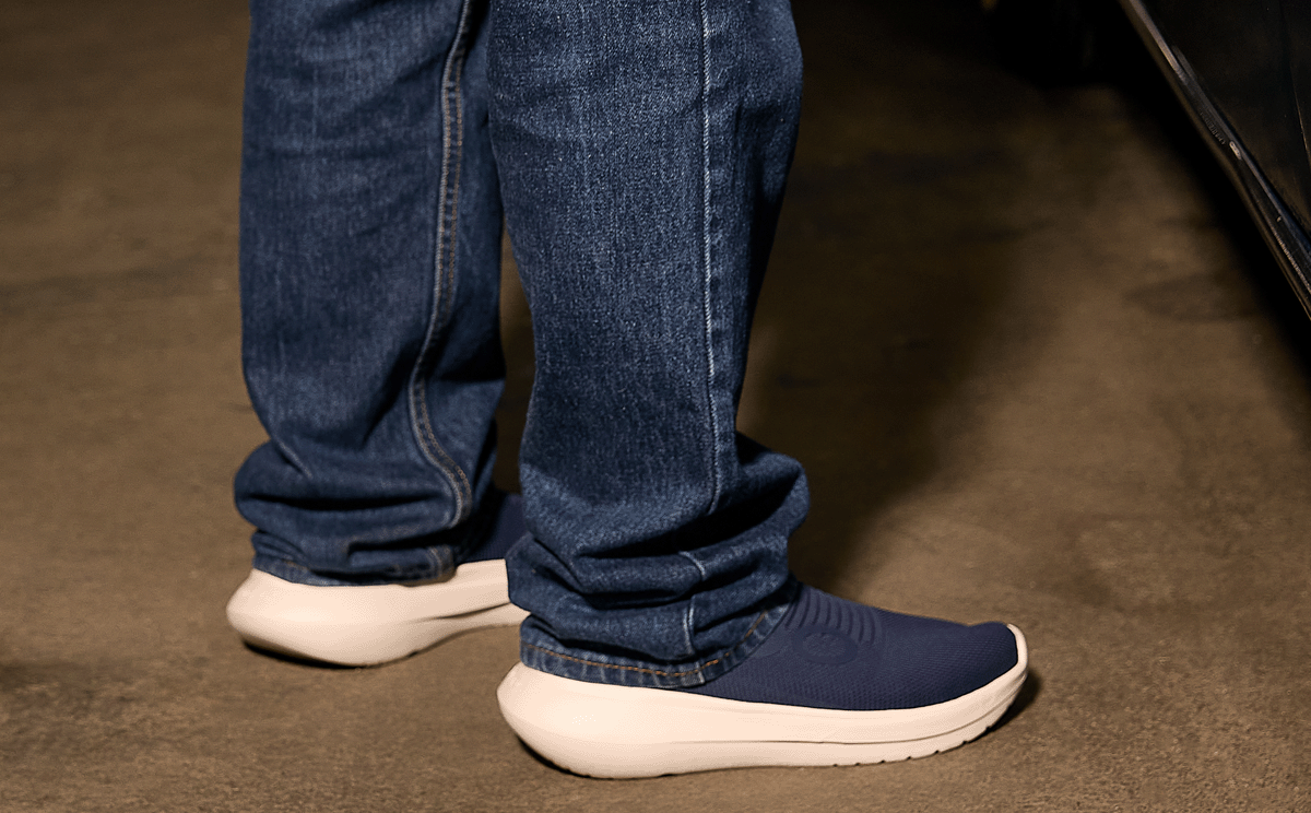 Men's OOmy Zen - Navy model standing in garage | lifestyle