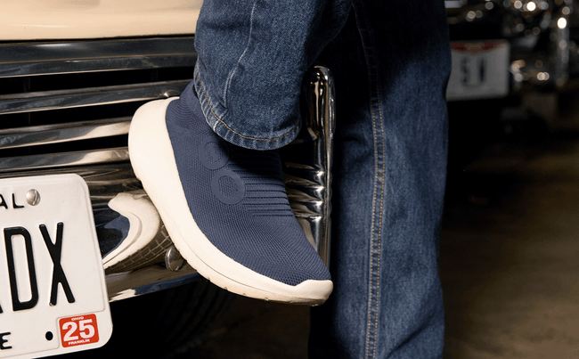 Men's OOmy Zen - Navy close up of shoe against hood of car | lifestyle