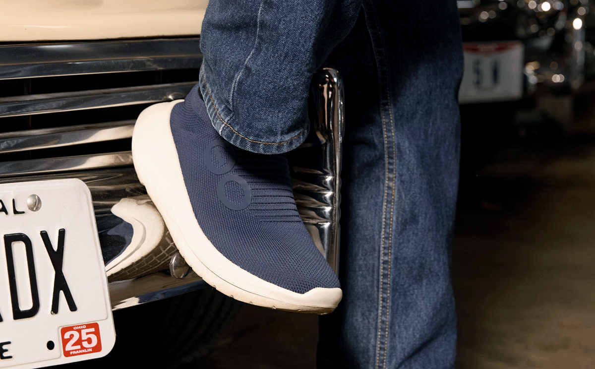 Men's OOmy Zen - Navy close up of shoe against hood of car | lifestyle