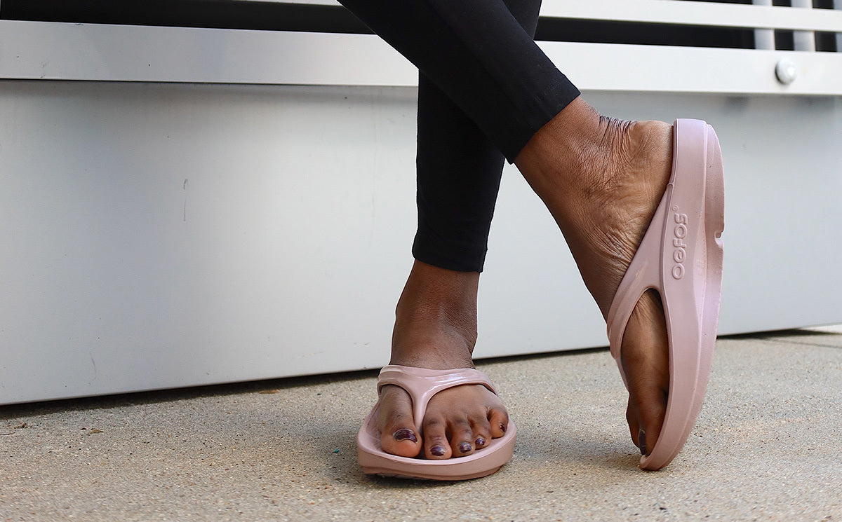 Women's OOlala Sandal - Stardust model standing with legs crossed | lifestyle