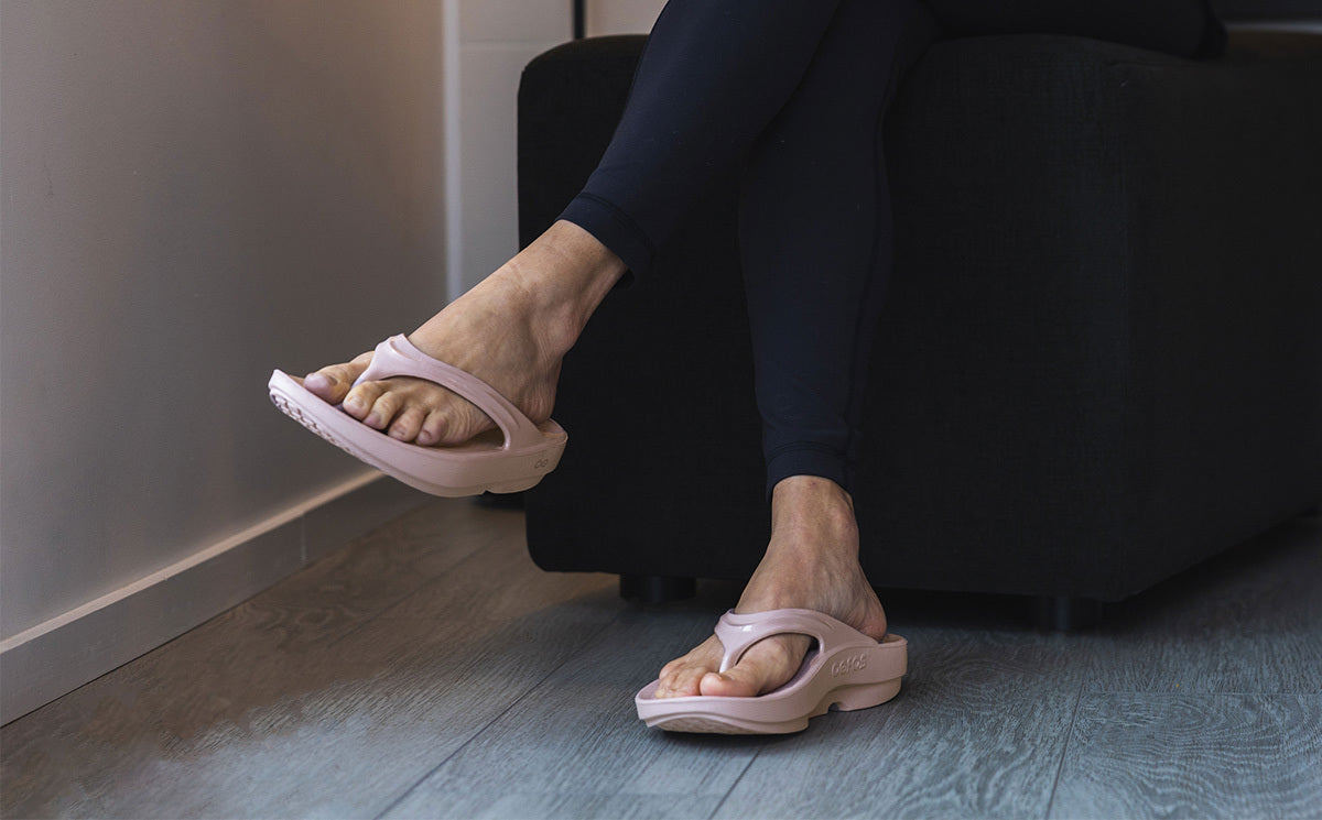 Women's OOlala Sandal - Stardust model sitting with legs crossed | lifestyle