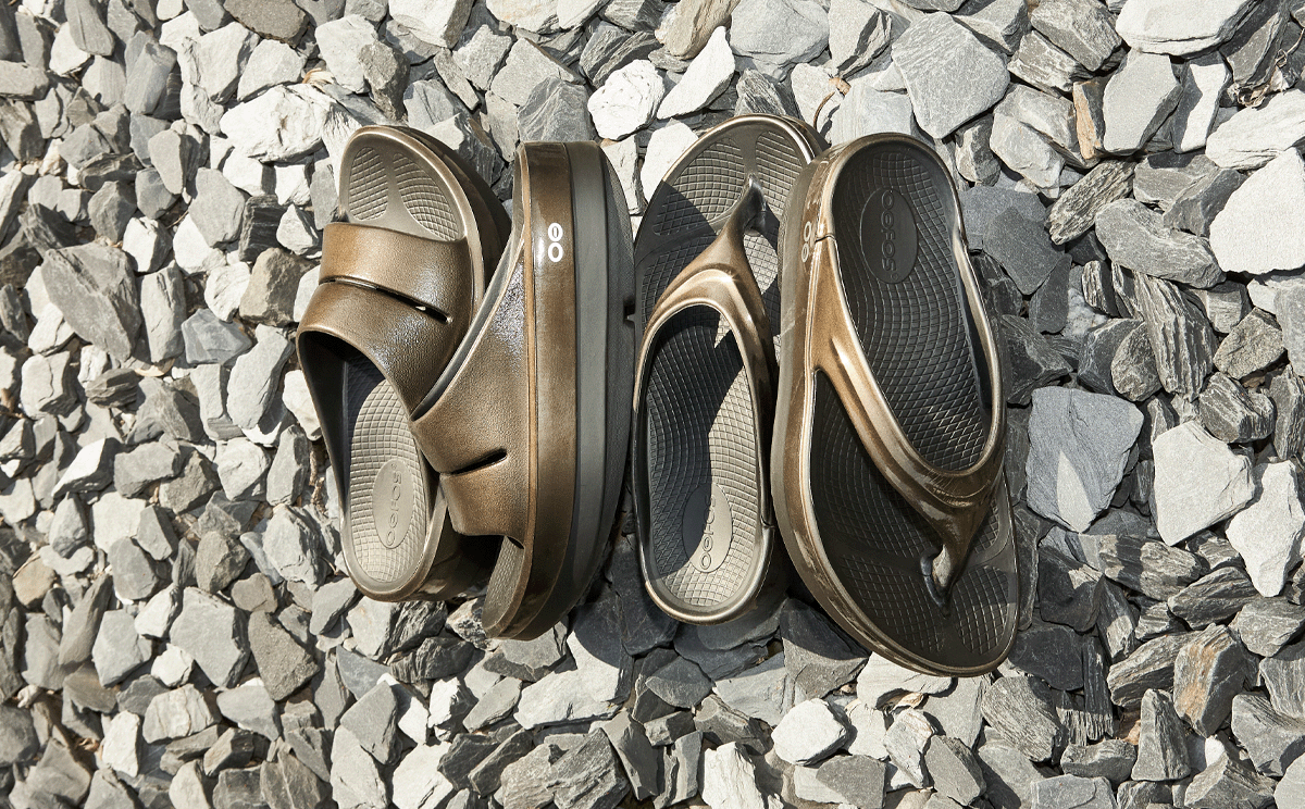 Women's OOmega Stacked Sandal - Titanium Mirror collection on rocks | lifestyle