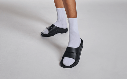 Women's OOahh Slide Sandal - Black model posing in studio | lifestyle