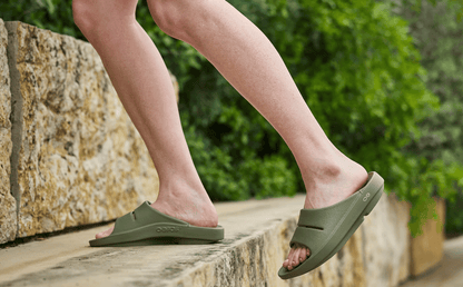 Women's OOahh Slide Sandal - Foliage model walking on steps outside | lifestyle