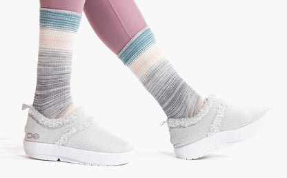 Women's OOcoozie Low Shoe -  Light Gray close up of shoes on model in studio