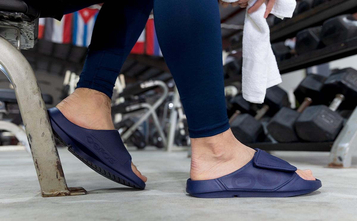 Men's OOahh Sport Flex Sandal - Navy side view of model weaaring shoes
