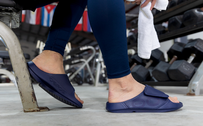 Men's OOahh Sport Flex Sandal - Navy side view of model weaaring shoes