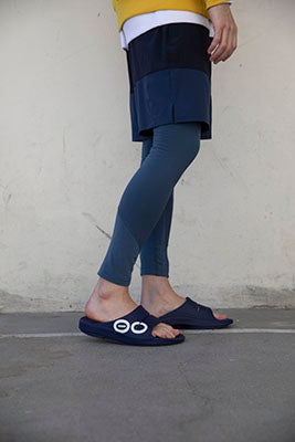 Men's OOahh Sport Slide Sandal - Navy White model standing wearing shoes