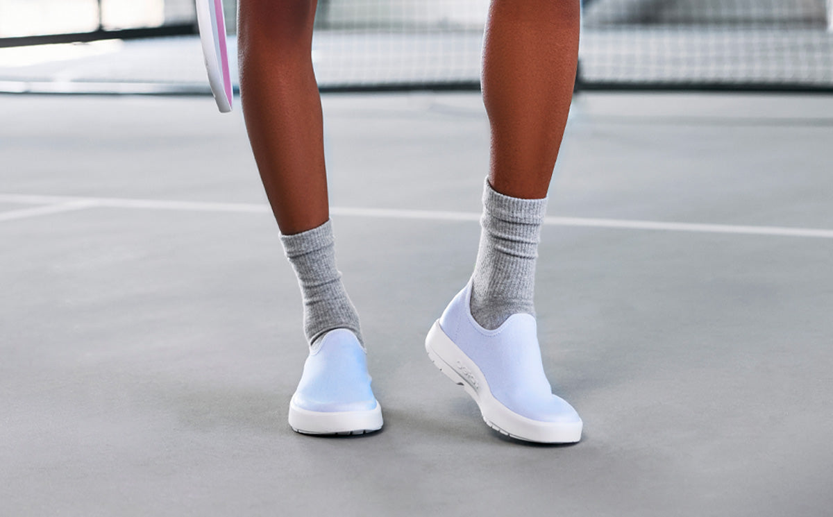 Woman wearing Purple Jade OOmg eeZee Low Shoe at pickleball court